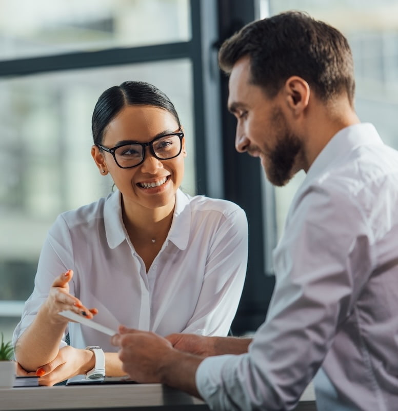 A woman shaking hands with a client